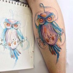 an owl tattoo on the left leg with words written below it and two owls in watercolors