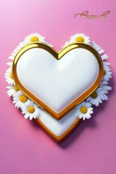 a heart shaped cookie decorated with daisies on a pink background