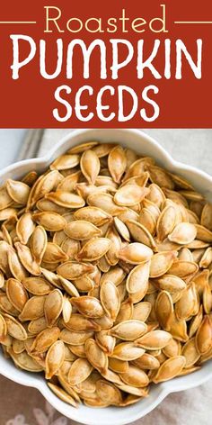 roasted pumpkin seeds in a white bowl with text overlay that reads roasted pumpkin seeds