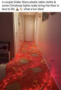 a hallway with red lights on the floor and an image of a christmas tree in the corner