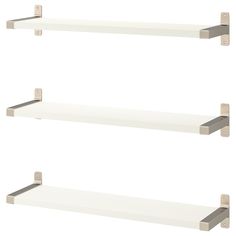 two white shelves with metal brackets on each shelf