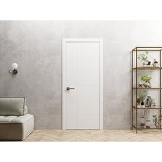 a living room with a couch and shelving unit next to a wall mounted planter