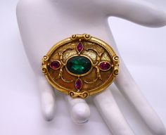 Vintage Antiqued Gold Tone Ornate Oval with Purple and Green Rhinestones  Victorian Revival Pin Brooch.  The pin is unmarked with a textured patterned back.  The pin is most likely from 1928 jewelry.  The pin mechanism works as designed.  Shipping via USPS Ground Advantage with Tracking and Insurance.  I am happy to combine shipping on multiple items.  Please feel free to contact me with any questions. 1928 Jewelry, Victorian Revival, Purple And Green, Pin Brooch, Antique Gold, Brooch Pin, Vintage Antiques, Brooches, Insurance