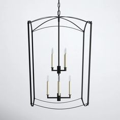 a chandelier with four candles hanging from it