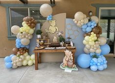 winnie the pooh birthday party with balloons and decorations