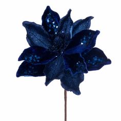 a blue flower with sequins on it's petals is shown in front of a white background