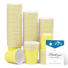 a bunch of yellow cups sitting next to each other