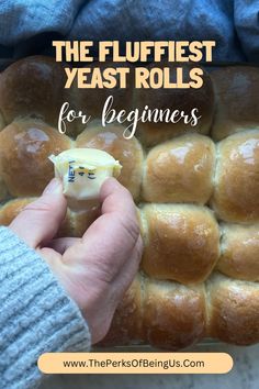 a person holding a miniature toy in front of a pile of rolls with the words, the flufffest yeast rolls for beginners