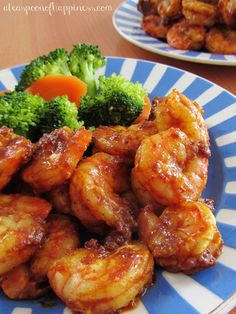 chicken wings and broccoli on a blue and white plate