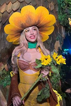 a woman in a costume with sunflowers on her head