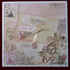 a close up of a piece of paper with flowers on it and a thank you tag