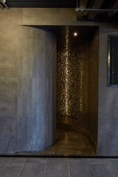 an open door leading to a bathroom with tiled walls