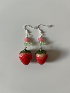 handmade strawberry earrings! 🍓 𓇼 ⋆｡˚ 𓆝⋆｡˚ 𓇼 every order ships in a bubble mailer and includes stickers and a card the item might not be the exact same as the pictures due to the items being handmade try to keep them away from water or chemicals, dont sleep or do anything where they can get caught on things 𓇼 ⋆｡˚ 𓆝⋆｡˚ 𓇼 彡 size: about 3 inches 彡 ships to america, canada, uk Cute Earrings Diy, Earring Making Ideas, Strawberry Earrings, Strawberry Bead Earrings, Pink Strawberry Print Earrings As Gift, Cute Strawberry Jewelry, Cute Red Earrings With Fruit Design, Handmade Kawaii Dangle Earrings, Pink Strawberry Print Earrings For Gift