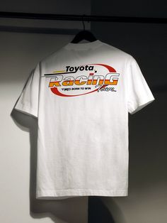 Get ready to show off your love for TRD with this vintage-inspired Toyota Racing Team graphic tee. Featuring the iconic TRD "Born to Win" slogan, this t-shirt is perfect for motorsport fans, off-road junkies, and even King of the Hammers Participants, who appreciate retro style and brand loyalty. ◆ Size Guide » Small - 28" Length, 18" Width » Medium - 29" Length, 20" Width » Large - 30" Length, 22" Width » XL - 31" Length, 24" Width » 2XL - 32" Length, 26" Width » 3XL - 33" Length, 28" Width » 4 Racing Team Shirts, Vintage Racing Tee, Grunge T Shirt Design, Vintage Sports Shirts, Vintage Racing Shirt, Sports Graphic Tees, Streetwear Shirt Design Ideas, 80s Graphic Tees, How To Style A Graphic Tee