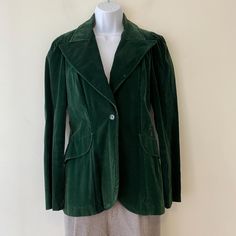 Dark green velvet single button jacket with pleated shoulders and a tailored fit. Single back vent. Flaps on front are flaps only, no pockets.  One small spot to collar 100% rayon Measurements taken lying flat 16" underarm to underarm 15" across waist 27" length  13-1/2" across shoulders 25" sleeve length Vintage Retro Clothing, Single Button Blazer, Retro Clothing, Button Jacket, Womens Blazers, Blazer Buttons, Green Velvet, Retro Outfits, Blazer Suit