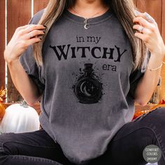 Whether you're embracing your witchy vibes or stepping into your magical era, our "In My Witchy Era" Comfort Colors Shirt is a perfect fit. Featuring a potion bottle design, this Witchcore tee is ideal for any Witchy Woman. It makes a thoughtful gift for your moon-loving, magical friends and adds a touch of enchantment to any wardrobe. ✦✦ All items are made to order ✦✦ They will ship within one week from one of our printing partners. Please allow sufficient time for production and shipping. Rest Potion Bottle, Witchy Woman, Comfort Colors Shirt, Green Witch, Witchy Vibes, Bottle Design, Vintage Stil, Comfort Colors, Style Vintage