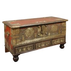 an old wooden chest with ornate designs on it