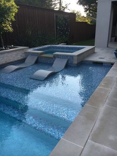 an empty swimming pool with steps leading up to it