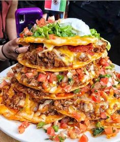 a stack of taco cake sitting on top of a white plate