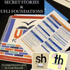 an open book sitting on top of a desk next to a pile of papers with the words secret stories and ufli foundations