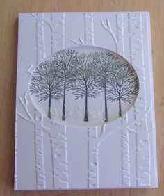 a white card with trees on it