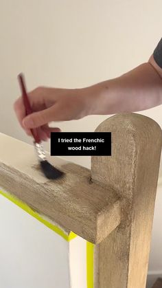 a person using a brush to paint a piece of wood with the words i tried the frenchic wood hackt