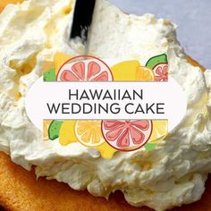 a close up of a piece of cake on a plate with a name tag that says hawaiian wedding cake