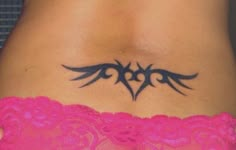 a woman's stomach with a tattoo on it