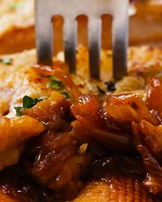 a fork is stuck into some food on a plate