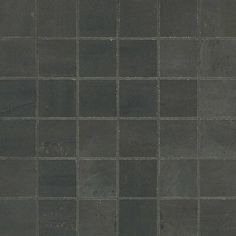 a black tiled wall with no one in it