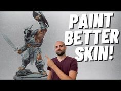 a man standing next to a statue with the words paint better skin in front of him