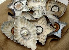 several pieces of paper with buttons and pearls on them