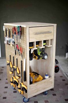 a wooden tool cabinet with tools on it