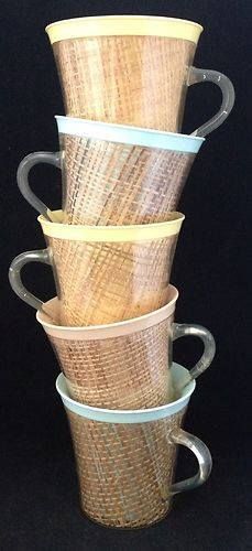 four coffee cups stacked on top of each other