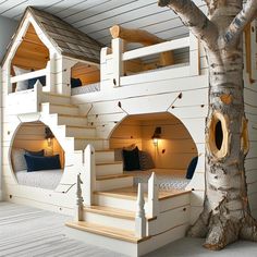 bunk beds are built into the side of a tree in a room with white walls