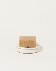 a bar of soap sitting on top of a white plate