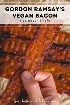 a hand holding up a bacon bar with text overlay that reads gordon ramsay'vegan bacon rice paper and tofu