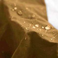 water droplets are on the surface of a cloth