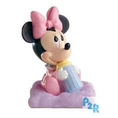 a minnie mouse figurine sitting on top of a cloud