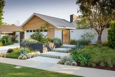 a house with landscaping in the front yard