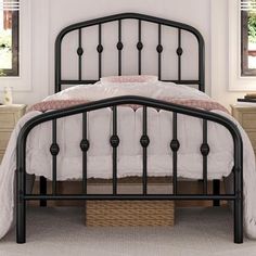 a black metal bed frame in a bedroom