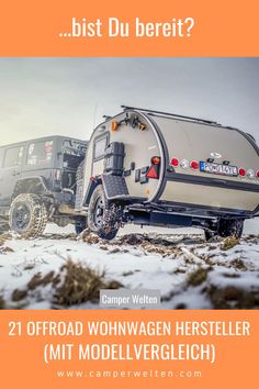 an offroad trailer parked in the snow next to a truck with a camper on it