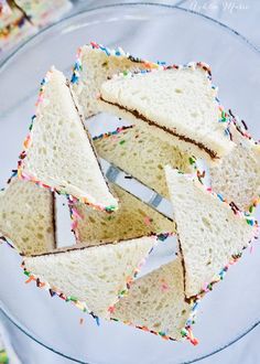 slices of white bread with sprinkles on a glass plate