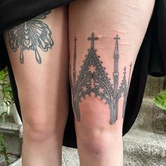 the legs of a woman with tattoos on them