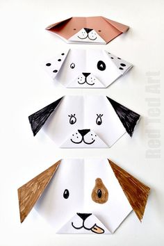 three paper dogs made to look like they have different faces