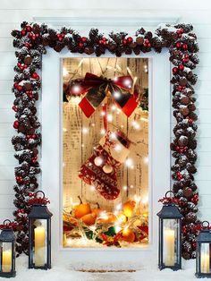 a decorated christmas window with candles and decorations