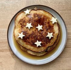 pancakes with white stars are on a plate