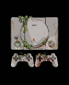 two video game controllers sitting next to each other in front of a black background with vines on it