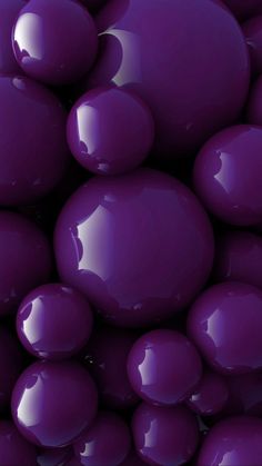 many purple balls are piled up together