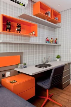 an orange and gray office with shelves above the desk